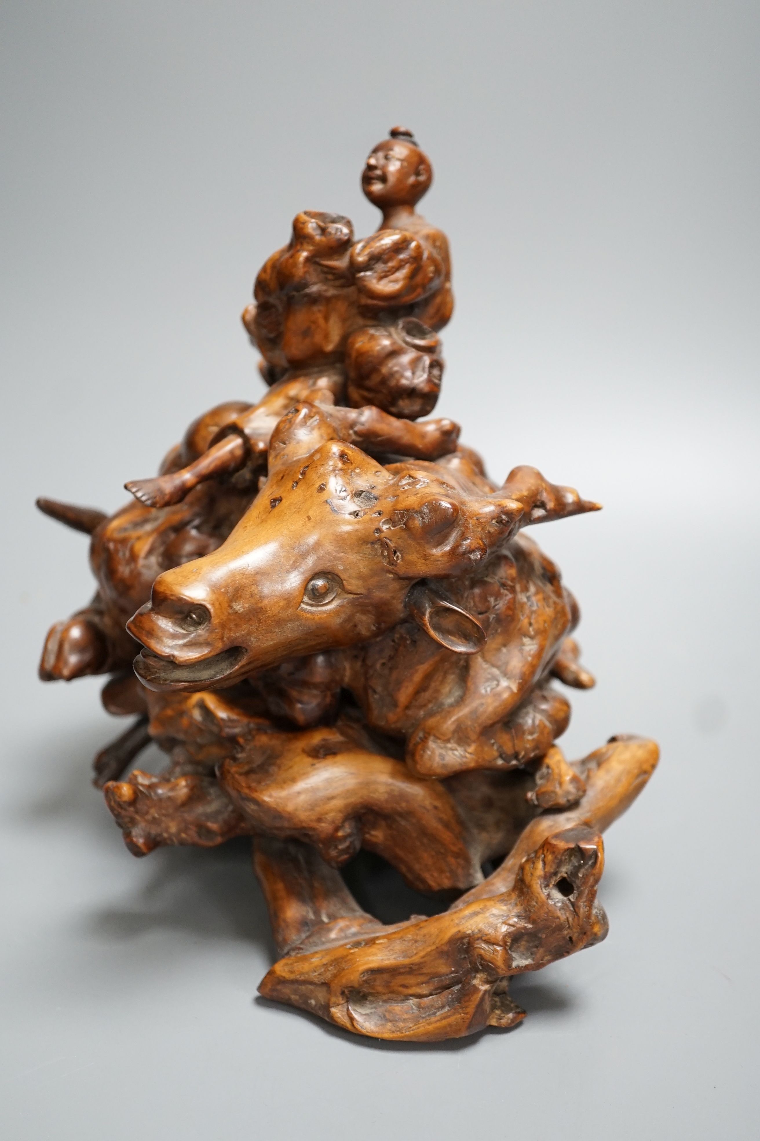 An 18th / 19th century Chinese rootwood figure of a boy on a buffalo 24cm